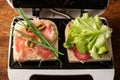 Making sandwiches from ham, vegetables and cheese in a sandwich maker. Two toasts with different fillings close-up Royalty Free Stock Photo