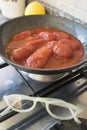 Making sauce woth peeled plum tomatoes Royalty Free Stock Photo
