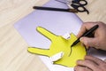 Making the simplest Easter bunny with your own hands a person draws a rabbit`s eyes nose and mouth Royalty Free Stock Photo