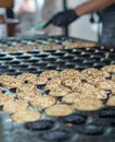 Making small pancakes, traditional Dutch poffertjes on street ma