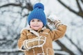 Making snowball and winter fun for children. Enjoying nature wintertime. Winter emotion. Winter child happy. Joyful Royalty Free Stock Photo