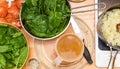 Making soup, an overhead view of food ingredients cooking and being prepared in a home kitchen Royalty Free Stock Photo