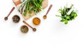 Making spices. Herbs in motar and dry flavorings on white table top-down copy space Royalty Free Stock Photo