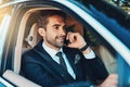 Making success happen from the comfort of his car. a handsome young corporate businessman on a call while commuting. Royalty Free Stock Photo