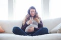 Making sure baby is hydrated. Full length shot of an attractive young pregnant woman drinking water while sitting on the Royalty Free Stock Photo