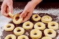 Making donuts and munchkins from raw yeast dough Royalty Free Stock Photo