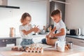 Making sweets. Little boy and girl preparing Christmas cookies on the kitchen Royalty Free Stock Photo