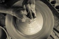 Pottery wheel with potter`s hands . Royalty Free Stock Photo