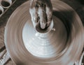 Pottery wheel with potter`s hands . Royalty Free Stock Photo