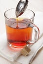 Making tea with tea infuser Royalty Free Stock Photo
