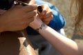 Making temporary, henna tattoo on wirst Royalty Free Stock Photo