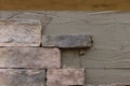 Making texture of wall facing with decorative stone tiles bricks Royalty Free Stock Photo