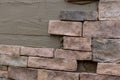 Making texture of wall facing with decorative stone tiles bricks Royalty Free Stock Photo