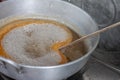Making Thai dessert Golden Egg yolk threads Foi Thong in a pot.