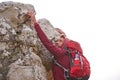 Making it to the peak. a young man enjoying a hike through the mountains. Royalty Free Stock Photo