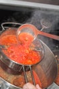 Making Tomato Sauce on the Stove Royalty Free Stock Photo