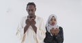 Making Traditional Fatiha Prayer To Allah God, African Muslim couple at home in Ramadan