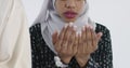 African Muslim couple at home in Ramadan Making Traditional Fatiha Prayer To Allah God While Wearing A Traditional Sudan