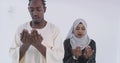 African muslim couple at home in ramadan Making Traditional Fatiha Prayer To Allah God