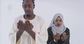 African muslim couple at home in ramadan Making Traditional Fatiha Prayer To Allah God