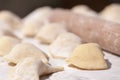 Making traditional food pierogy with dough roller