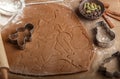 Making traditional gingerbread. Christmas. New year. Raw dough, cutting cookie and condiments on the table Royalty Free Stock Photo