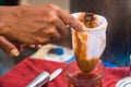 Making traditional Thai milk tea using coffee bag in Stainless Steel Pot. Old Thai tea made shop street food Royalty Free Stock Photo