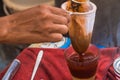 Making traditional Thai milk tea using coffee bag in Stainless Steel Pot. Old Thai tea made shop street food Royalty Free Stock Photo