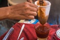 Making traditional Thai milk tea using coffee bag in Stainless Steel Pot. Old Thai tea made shop street food Royalty Free Stock Photo