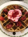 making waffles, strawberries, whipped cream, cherry Royalty Free Stock Photo