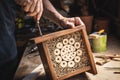 Making wooden insect hotel in workshop