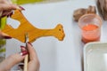 Making wooden toys. Coat toys with natural oil. Safe toys. Girl decorates toys. Educational toys Royalty Free Stock Photo