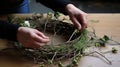 Making of wreath with wire- thread and spruce twigs