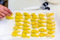 Makings of Italian Tortelli filled with ricotta, parmesan cheese, and spinach