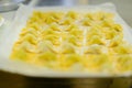 Makings of Italian Tortelli filled with ricotta, parmesan cheese, and spinach