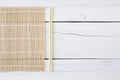 Makisu and chopsticks on a white table Royalty Free Stock Photo