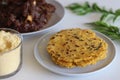 Makki ki roti or Maize roti served with mutton roast. An Indian flat unleavened bread made from corn meal flour served with mutton