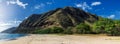 Makua beach panoramic view with beatiful mountains and cloudy sky in the background