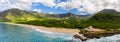 Makua beach and valley on west coast of Oahu in aerial shot over ocean