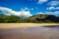 Makua beach view with beatiful mountains and cloudy sky in the background, Oahu island