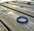 Mala - buddhistic bracelet from blue beads to counting bows and mantras by meditation Royalty Free Stock Photo