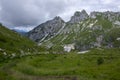 Mala Spice Cime Verdi peaks view from Mangart saddle, Slovenia\'s Highest Panoramic Road, heavy clouds before rain