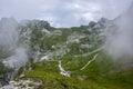 Mala Spice Cime Verdi peaks view from Mangart saddle, Slovenia\'s Highest Panoramic Road, heavy clouds before rain, foggy day