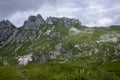 Mala Spice Cime Verdi peaks view from Mangart saddle, Slovenia\'s Highest Panoramic Road, heavy clouds before rain