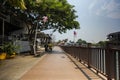 Malacca, Malaysia - August 10, 2022: Walkway along the Melaka river bank at the Malacca river. The walkway on stilts over the