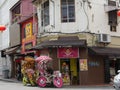 Malacca, Malaysia--February 2018: Colorful decorated trishaws wait for passengers outside a restaurant in Jonker Street, one of