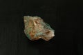 Malachite from Morocco or Republic of the Congo. Natural mineral stone on black background. Mineralogy, geology, magic of stones,