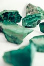 Malachite polished stones on a white background. Copy, empty space for text Royalty Free Stock Photo