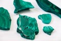 Malachite polished stones on a white background. Copy, empty space for text Royalty Free Stock Photo