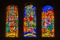 Colorful religious scene on stained glass windows inside the Cathedral of Malaga, Andalusia, Spain